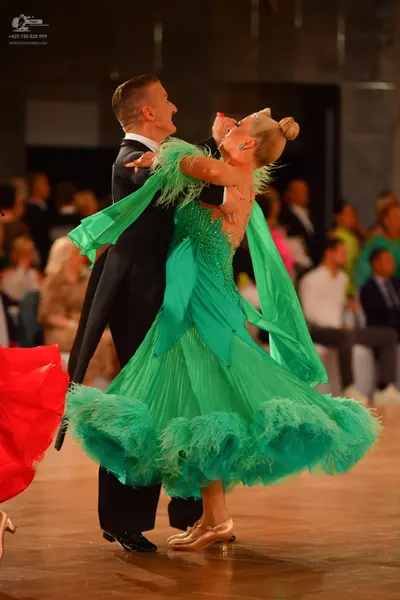 Dancesport competitor: Male dancer: black suit