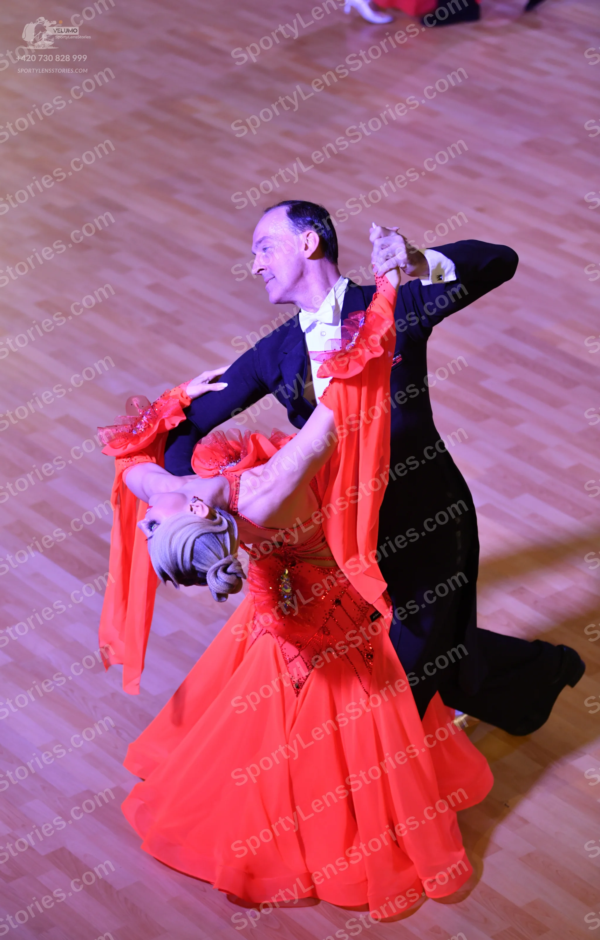 Dancesport competitor: Male dancer: black suit with a white shirt