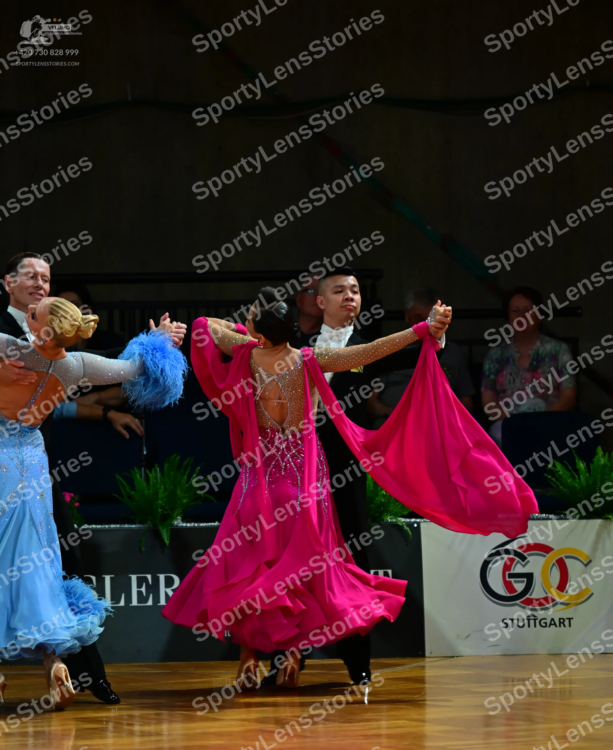 Dancesport competitor: Female dancer 1: light blue ballroom gown with a voluminous skirt and large blue