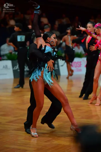 Dancesport competitor: Male dancer: black long-sleeved shirt and black trousers