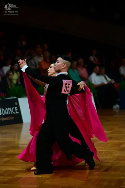 Dancesport competitor #55: Male dancer: black long-sleeved top and black trousers