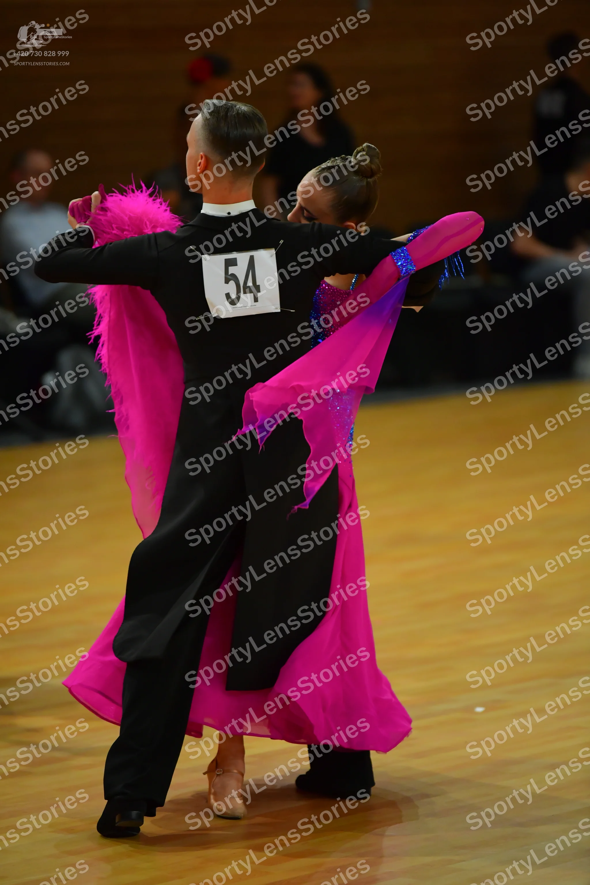 Dancesport competitor: Male dancer: black ballroom tailcoat with a white collar