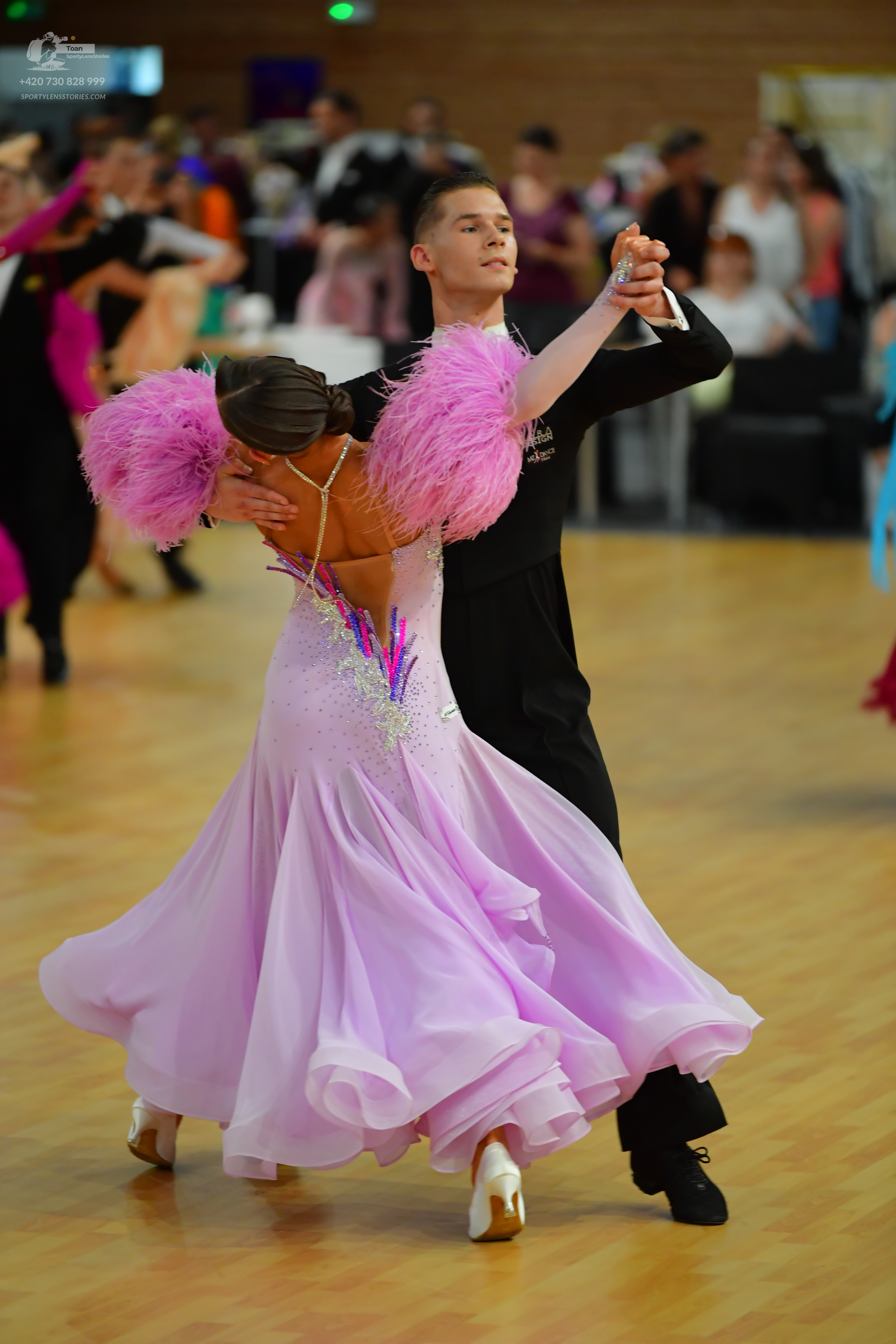 Dancesport competitor: ** Black tail suit with white sequin lapels