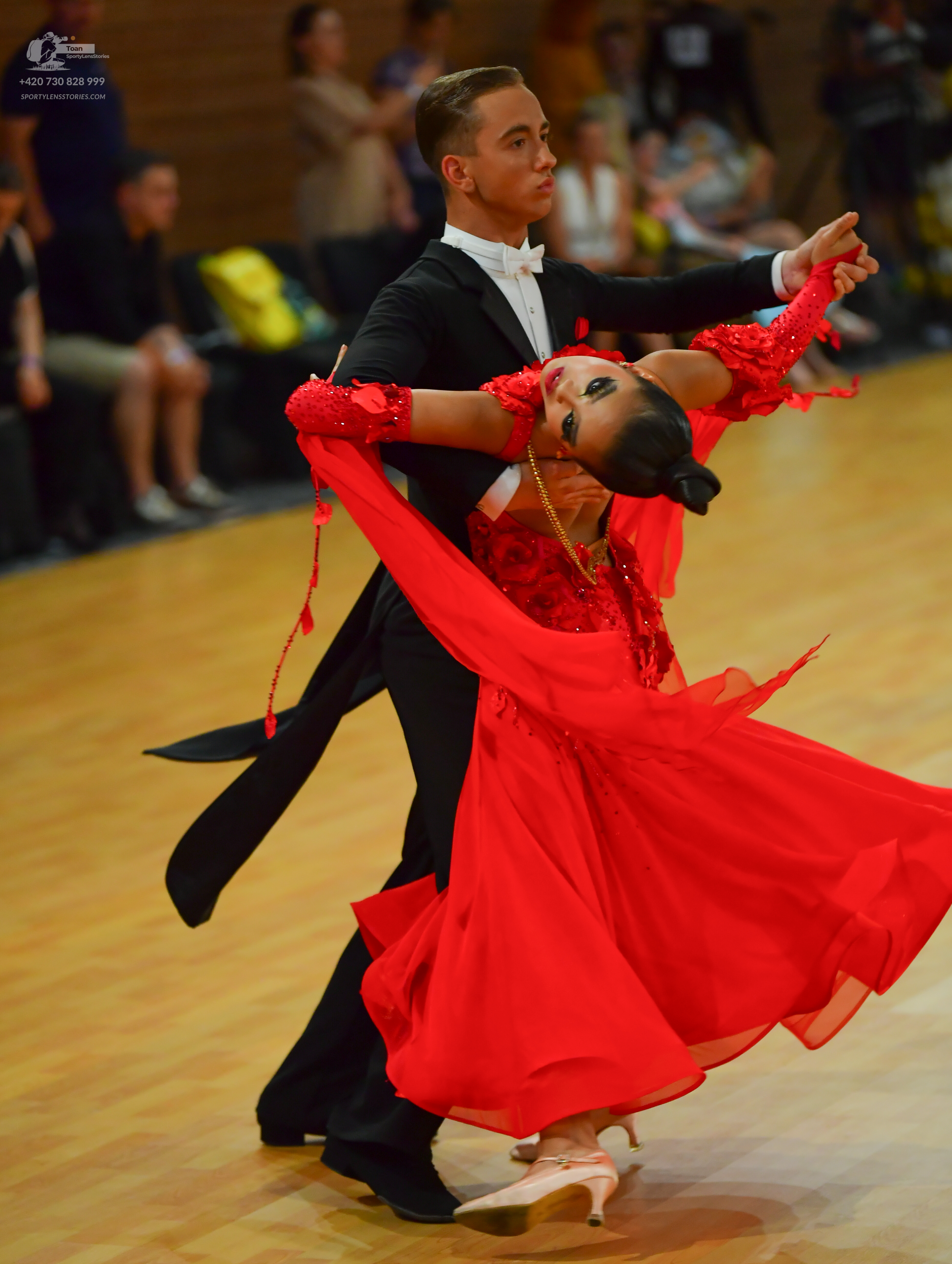 Dancesport competitor: Male dancer: black tuxedo with a white shirt and white bowtie