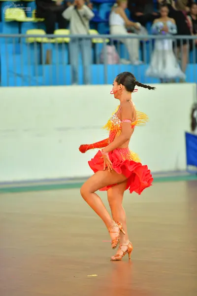Dancesport competitor: ** Female: Red Latin Dress