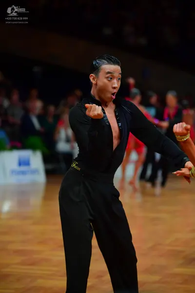 Dancesport competitor: Male dancer: black, long-sleeved, satin-finish shirt with a deep V-neck and blac