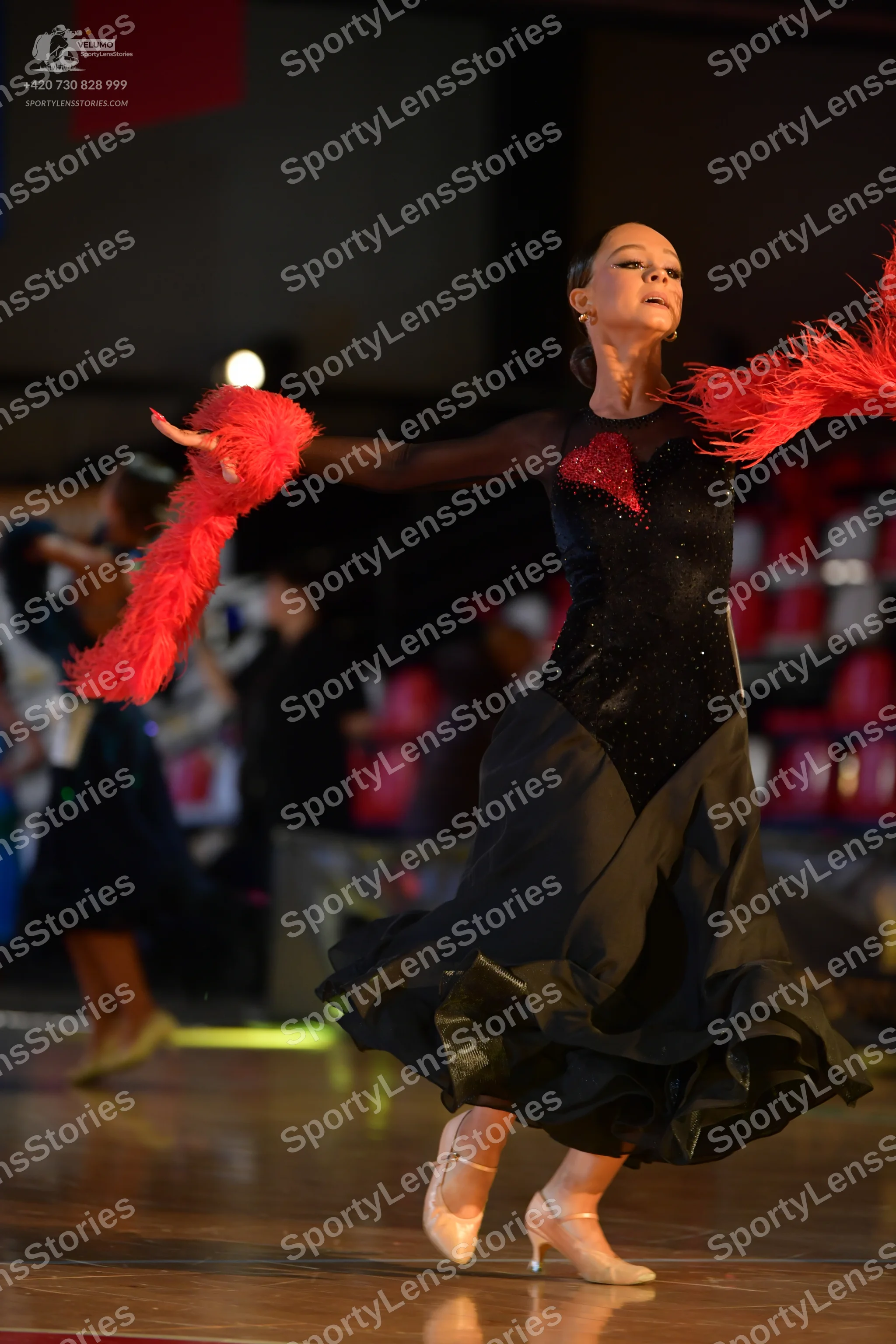 Dancesport competitor: ** Female
* **Color:** Red
* **Fabric:** Satin (likely with a glossy finish)