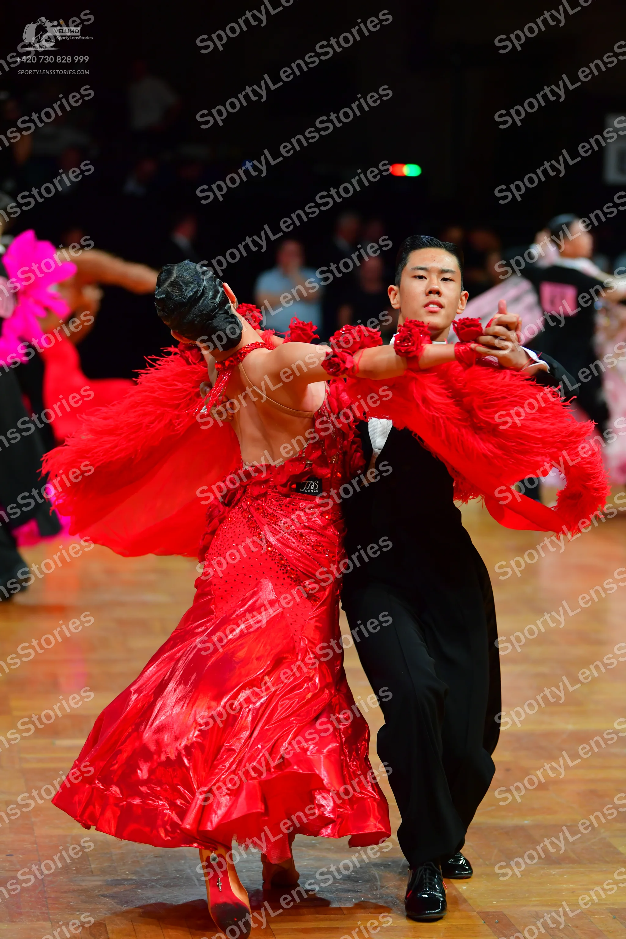 Dancesport competitor: Male dancer: black suit with a white shirt