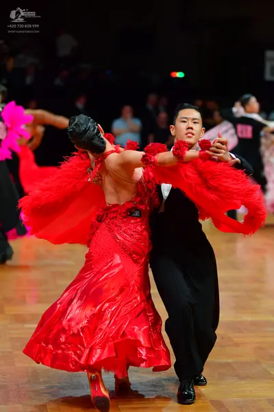 Dancesport competitor: Male dancer: black suit with a white shirt
