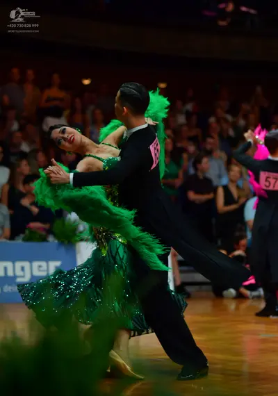 Dancesport competitor: Male dancer: black suit with a white shirt