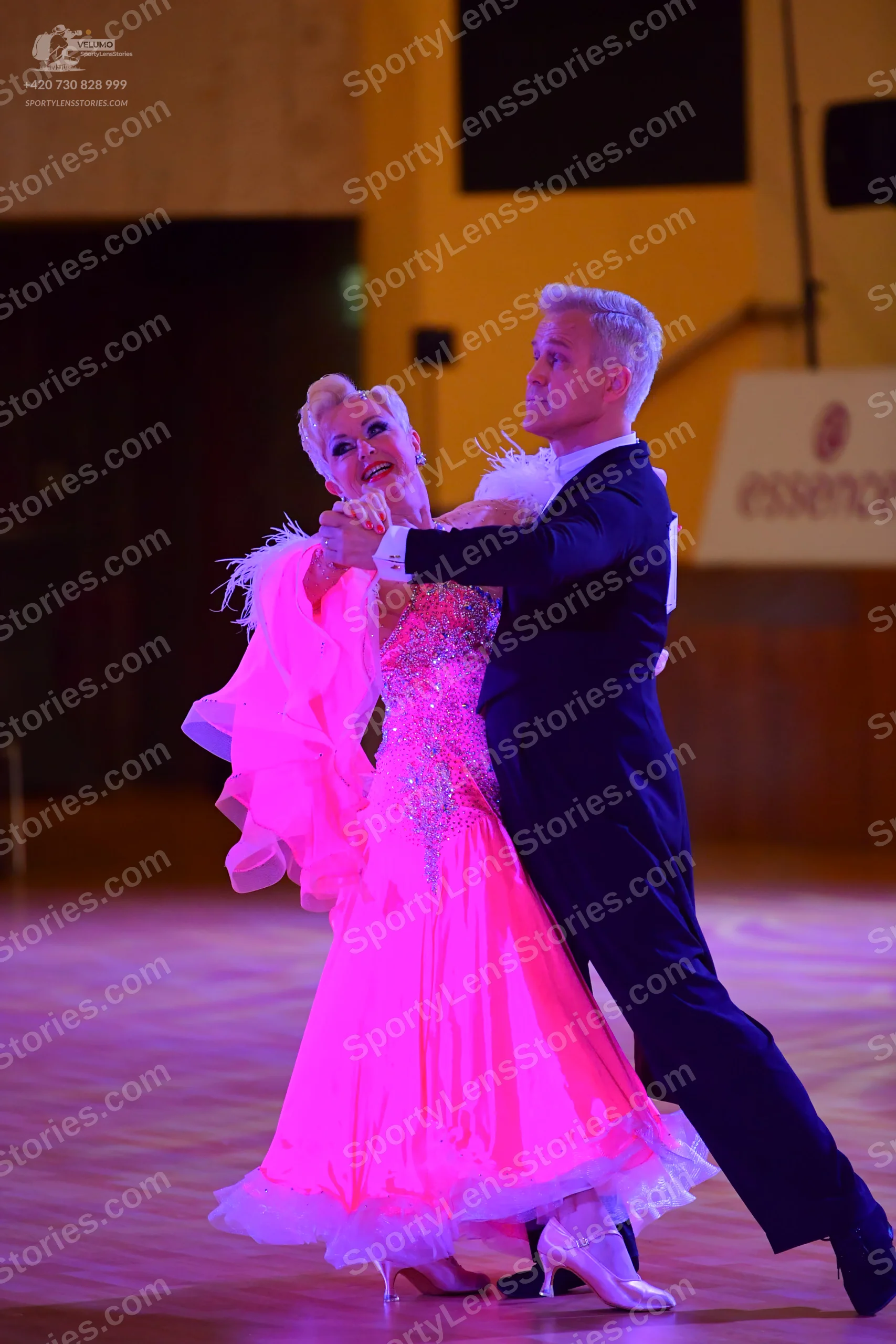 Dancesport competitor: Male:** Black tail suit with a subtle sequin embellishment on the lapels