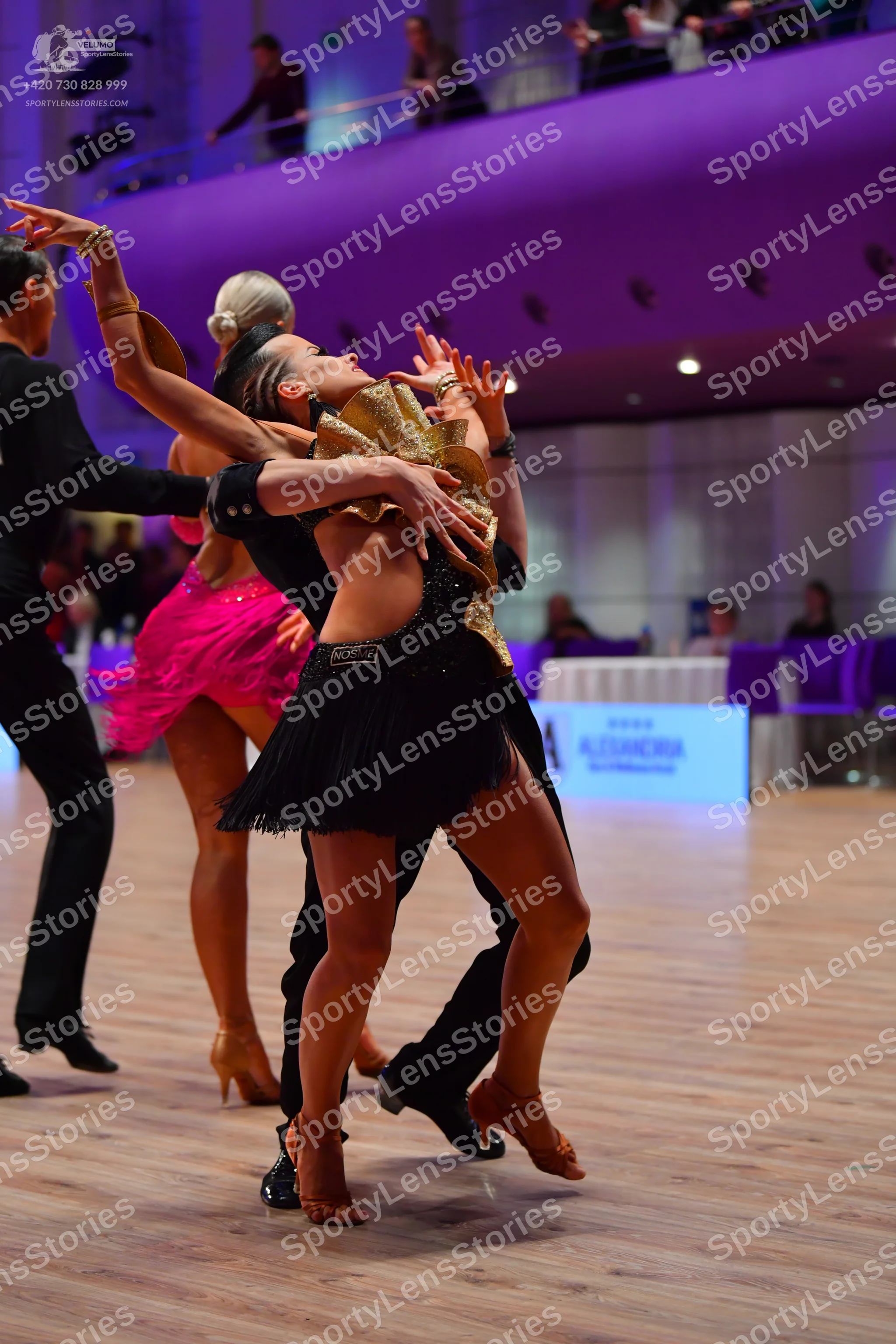 Dancesport competitor: Male dancer: black long-sleeve shirt and black trousers