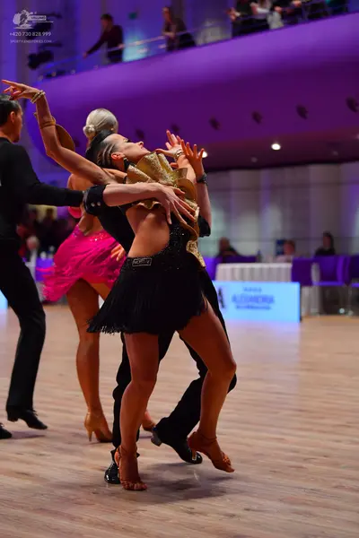 Dancesport competitor: Male dancer: black long-sleeve shirt and black trousers