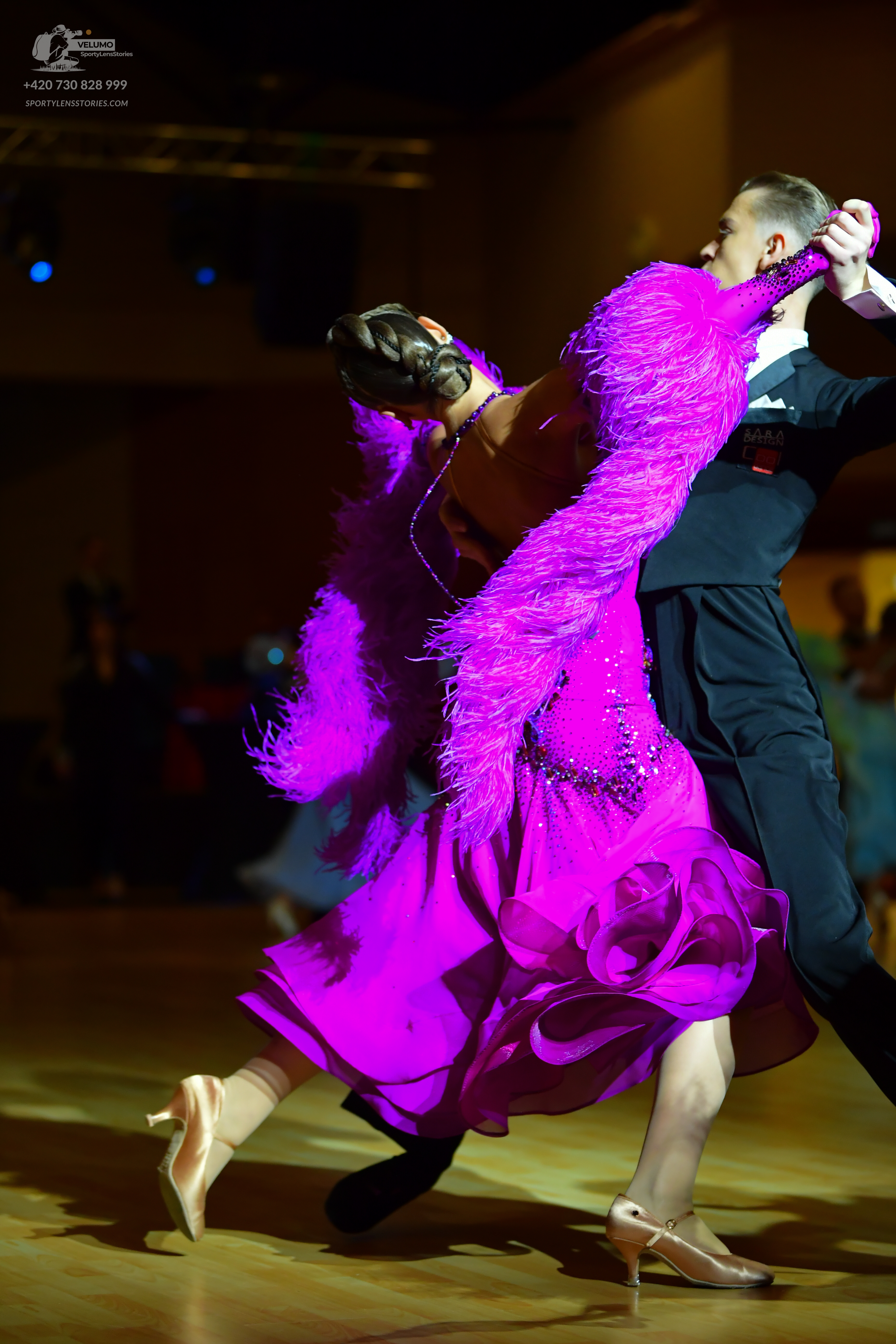 Dancesport competitor: Male dancer: black suit with white shirt and black bowtie