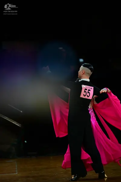 Dancesport competitor #55: Male dancer: black long-sleeved top and black trousers