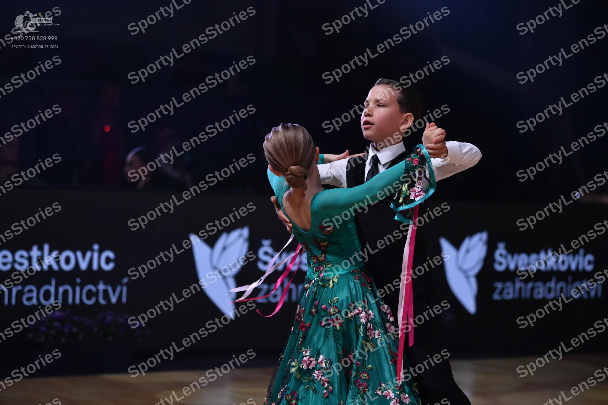 Dancesport competitor: Male dancer: white long-sleeved shirt with a black necktie and black trousers
