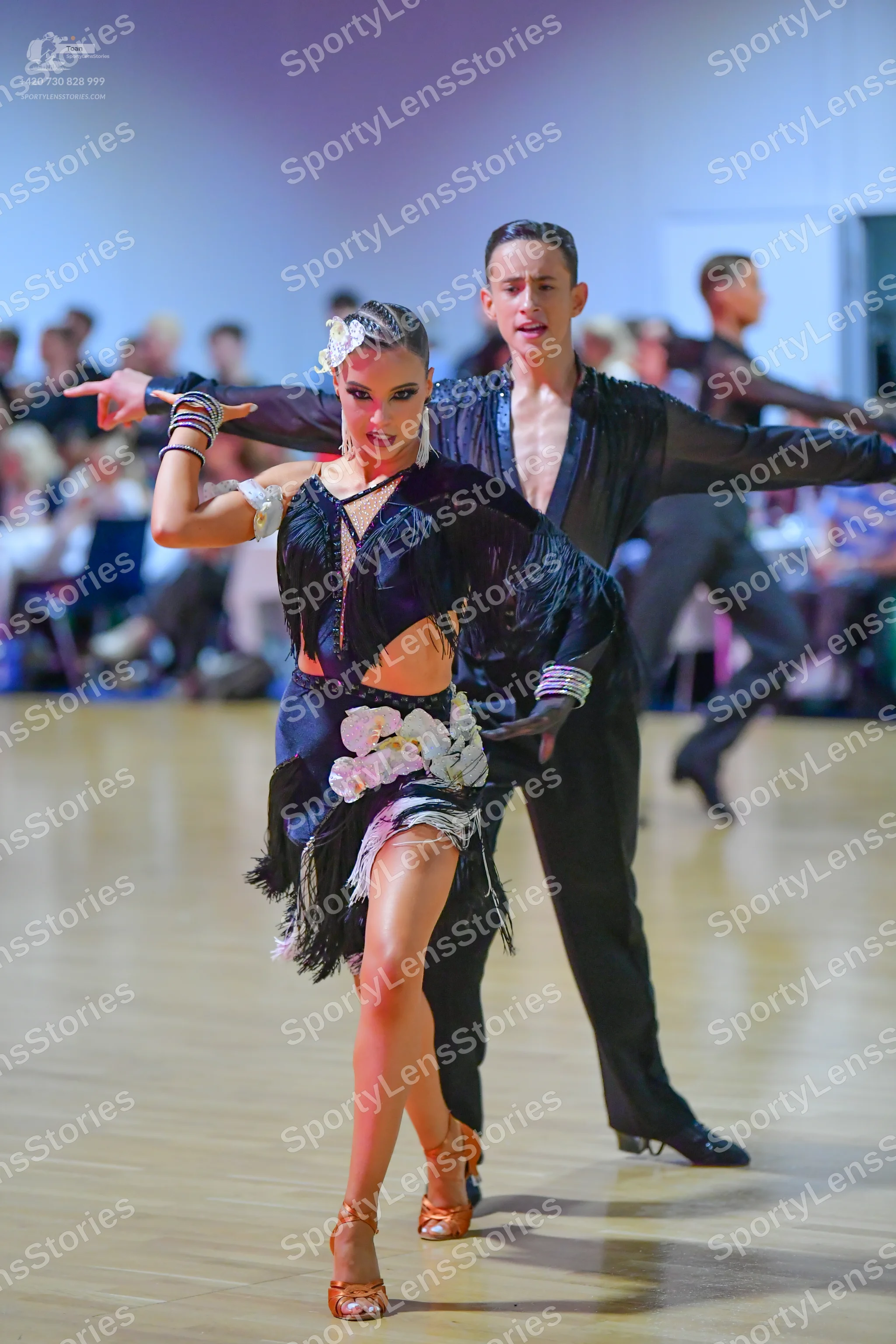 Dancesport competitor: Male dancer: black shirt with textured panels on the chest and black trousers