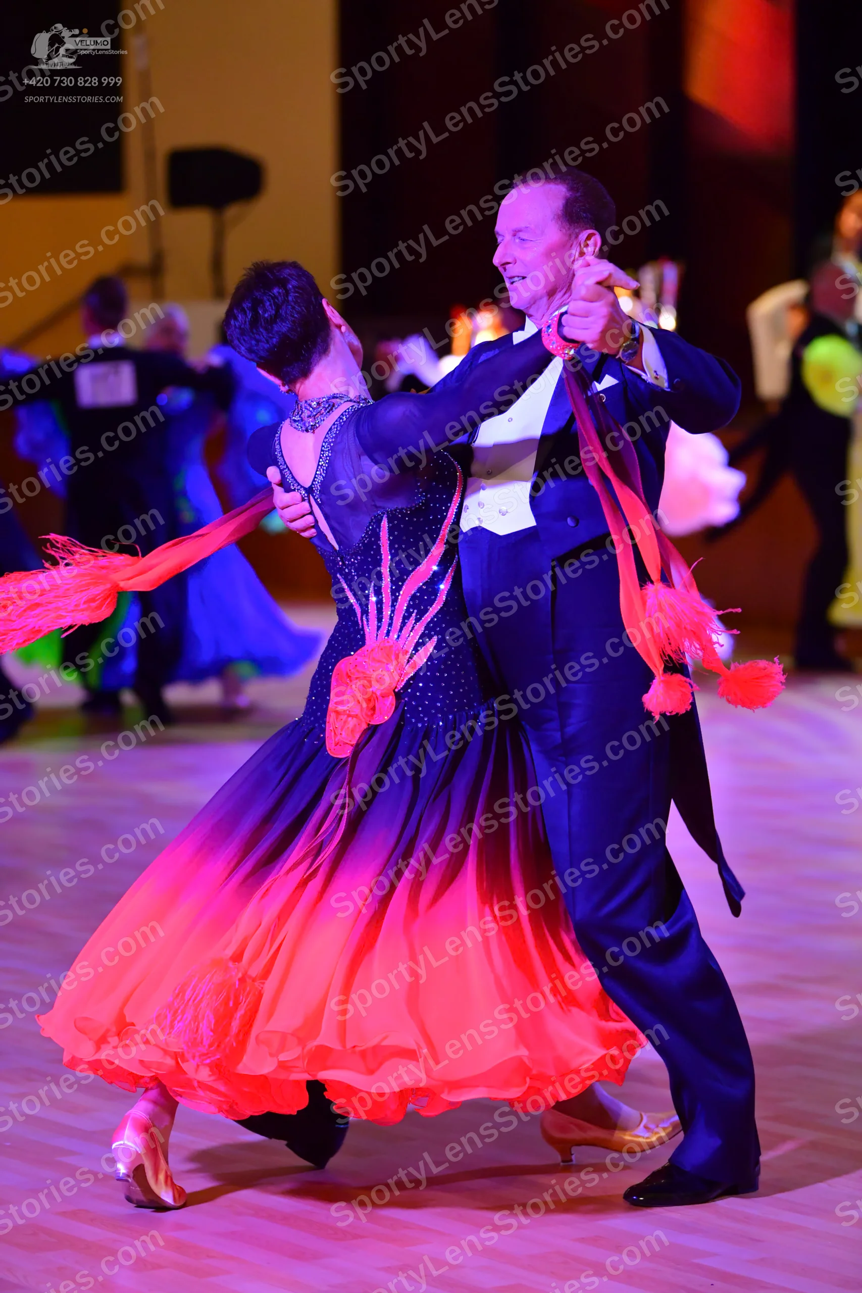 Dancesport competitor: Male:** Black tailsuit with sequin lapels and a white vest
