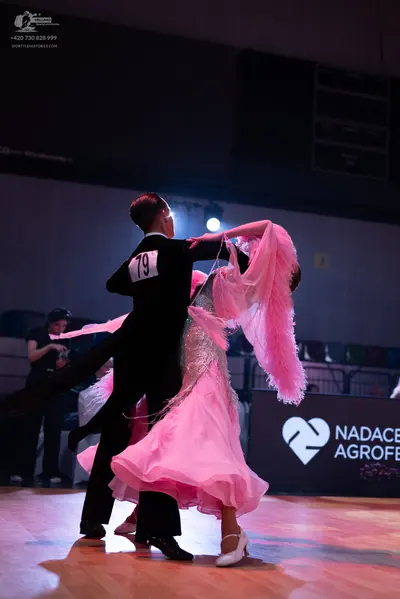 Dancesport competitor: Male dancer: black suit