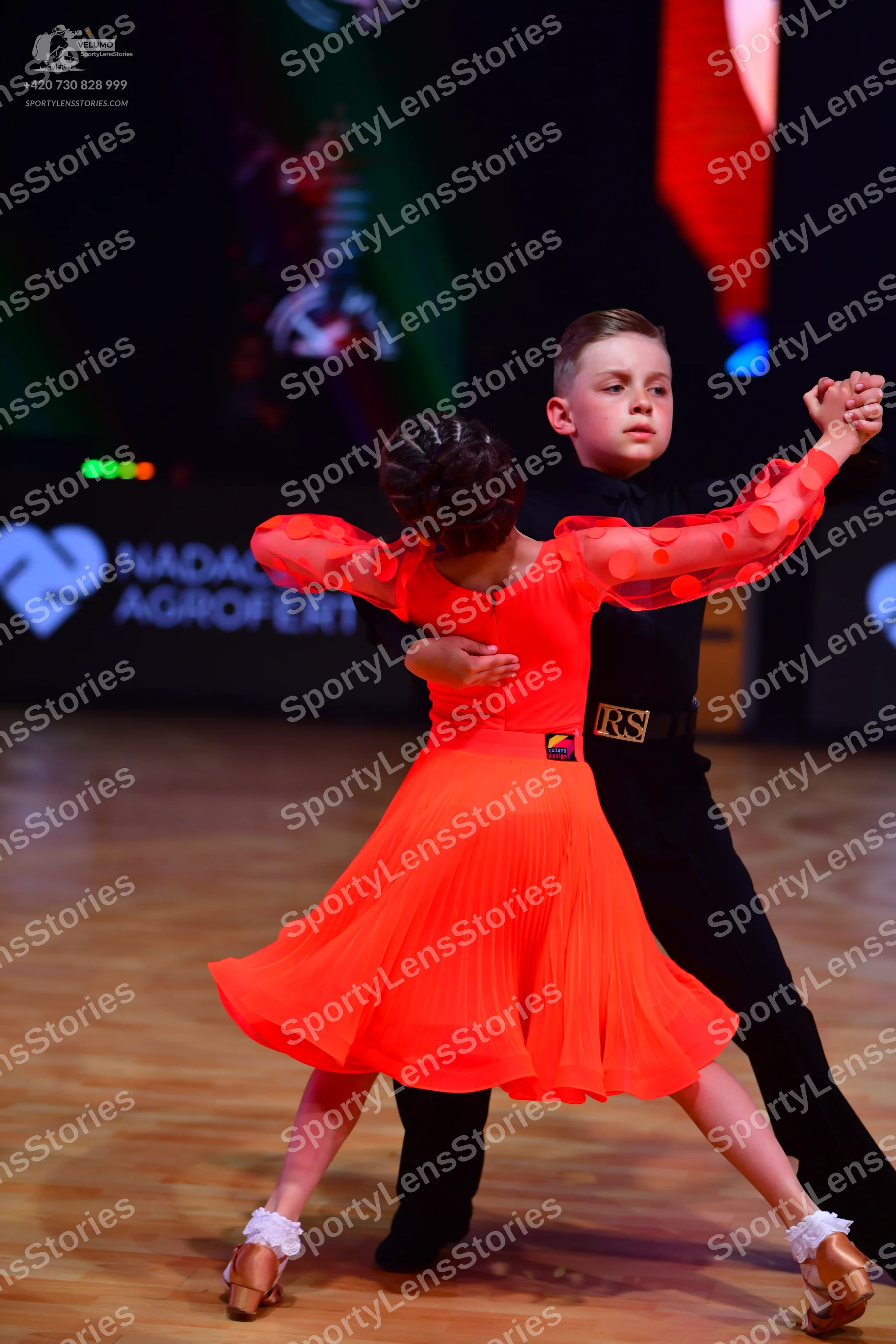 Dancesport competitor: Male dancer: black long-sleeved shirt and black trousers