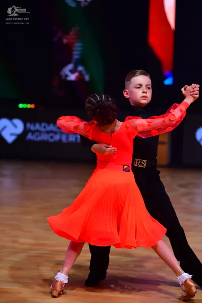 Dancesport competitor: Male dancer: black long-sleeved shirt and black trousers