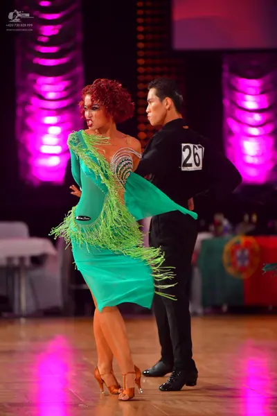 Dancesport competitor #267: Female dancer: teal latin dress with long fringe