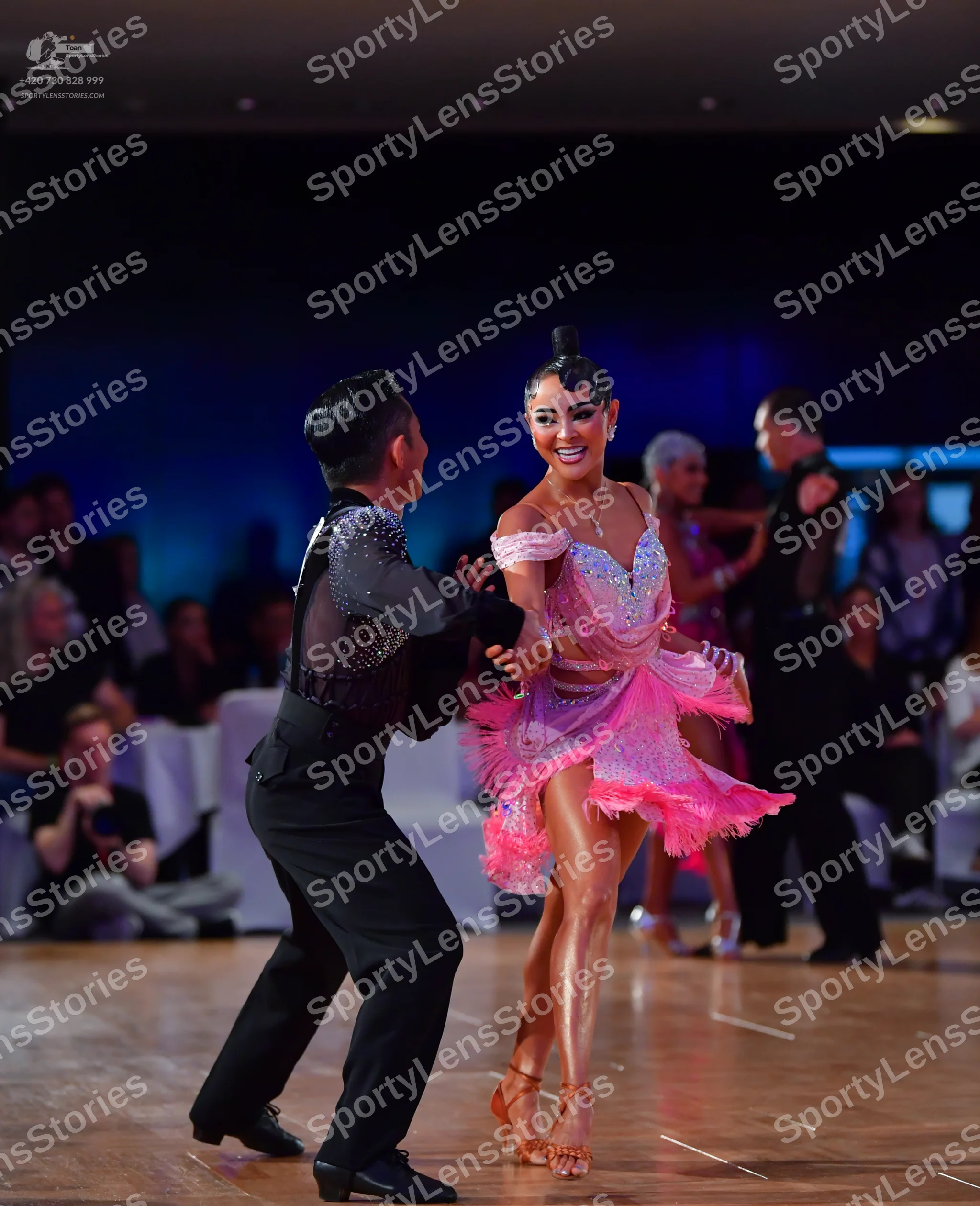 Dancesport competitor: Male dancer: black long-sleeved shirt with silver sequin embellishments on the s