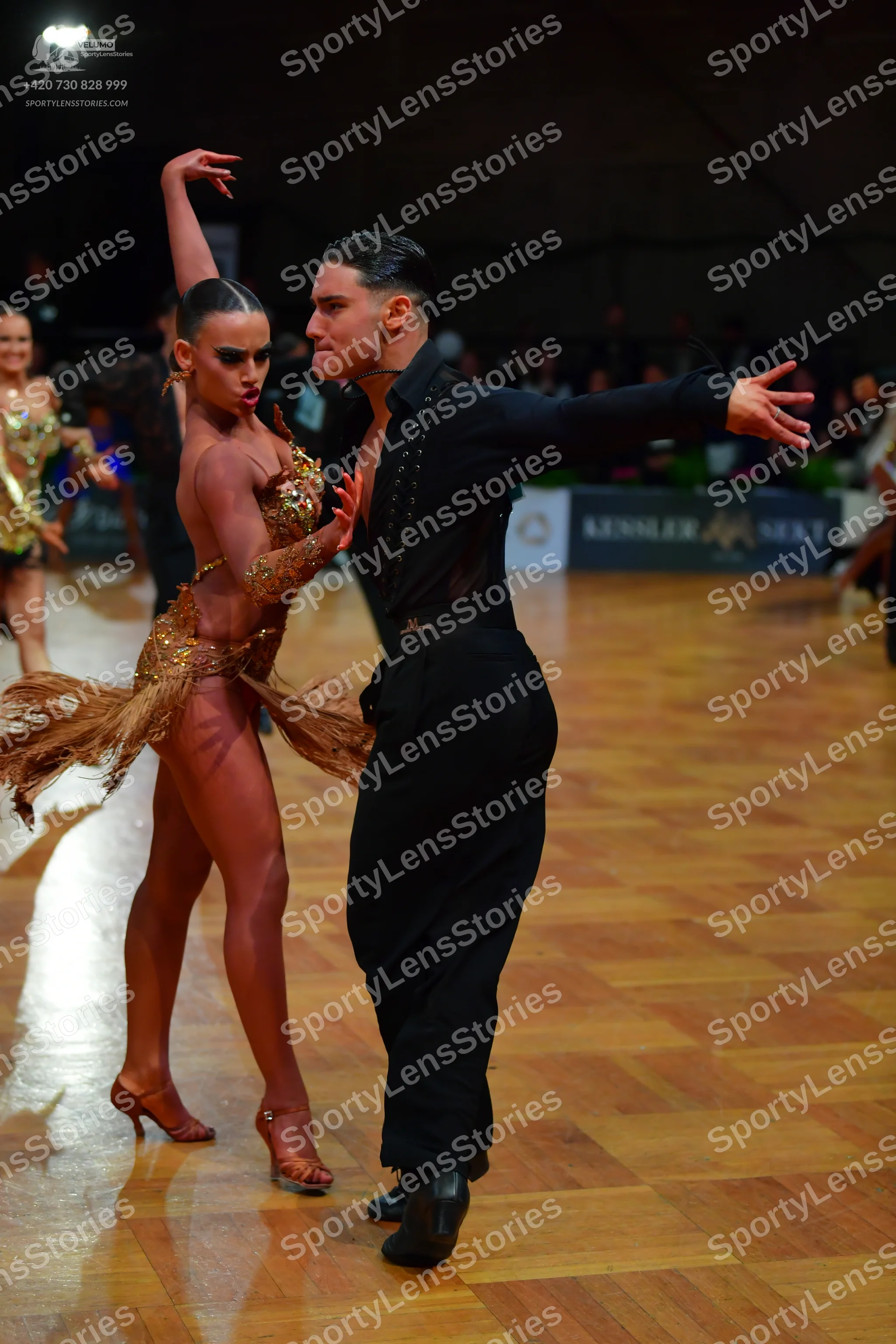 Dancesport competitor: Male dancer: black long-sleeved shirt and black trousers