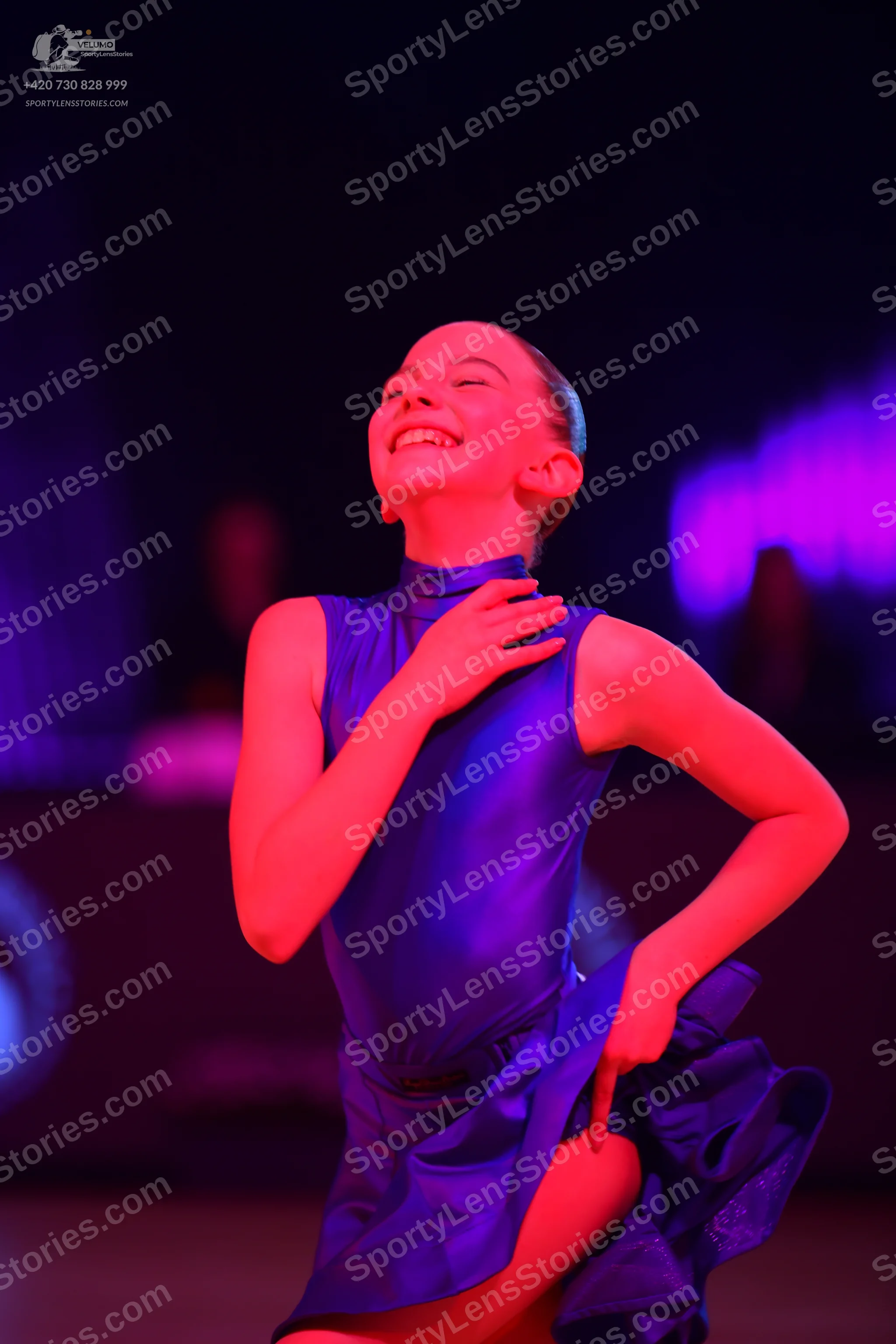 Dancesport competitor: Female dancer: blue satin latin dress