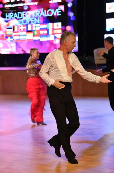 Dancesport competitor: ** Black tailsuit