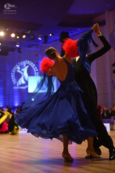 Dancesport competitor: Male dancer: black formal ballroom suit