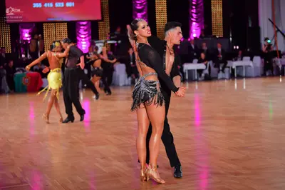 Dancesport competitor: Male dancer: black latin dance shirt with black trousers