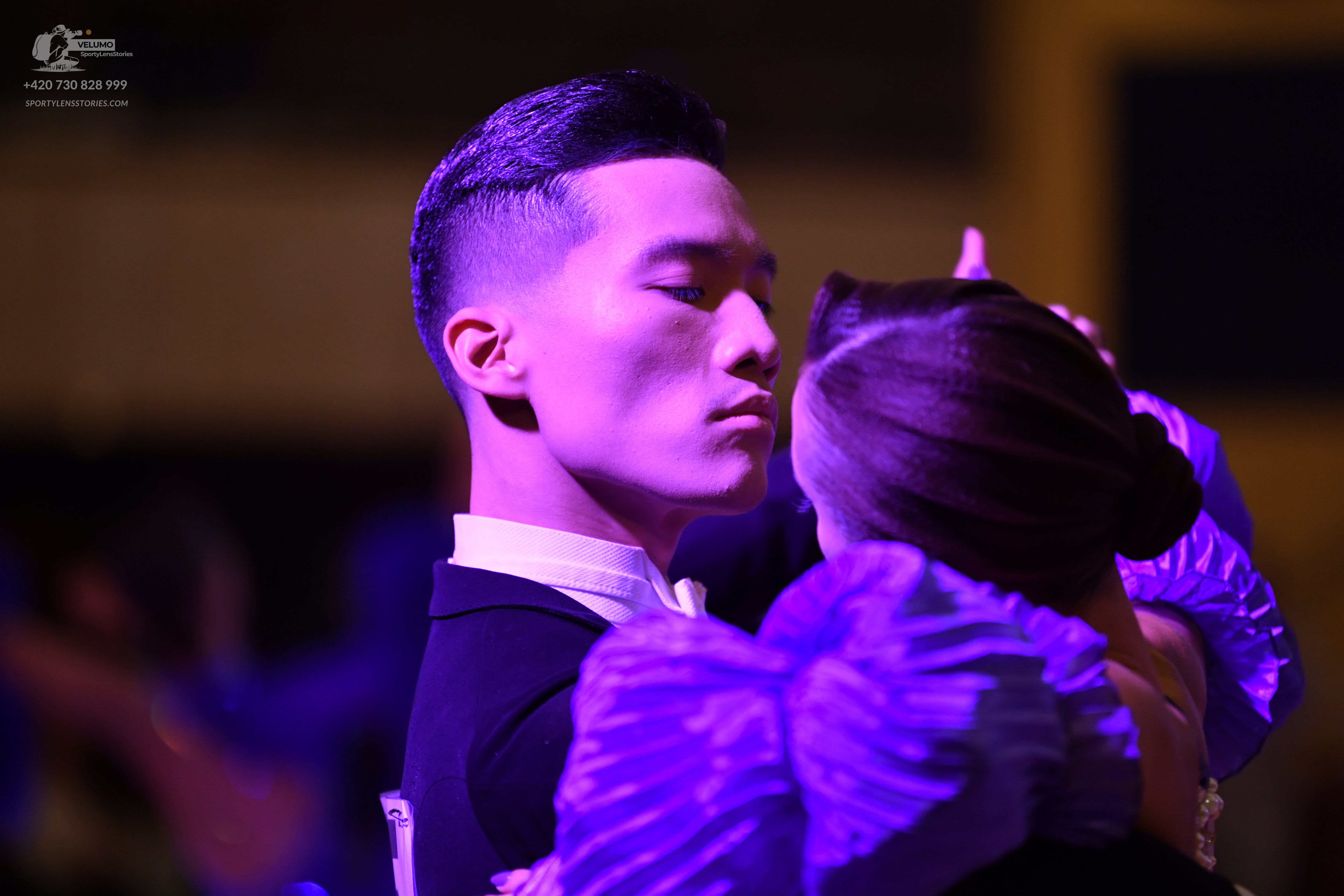 Dancesport competitor: Male dancer: black suit with a white shirt