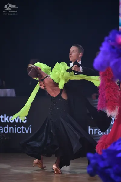 Dancesport competitor: Male dancer: black ballroom tailcoat with a white shirt and black bow tie