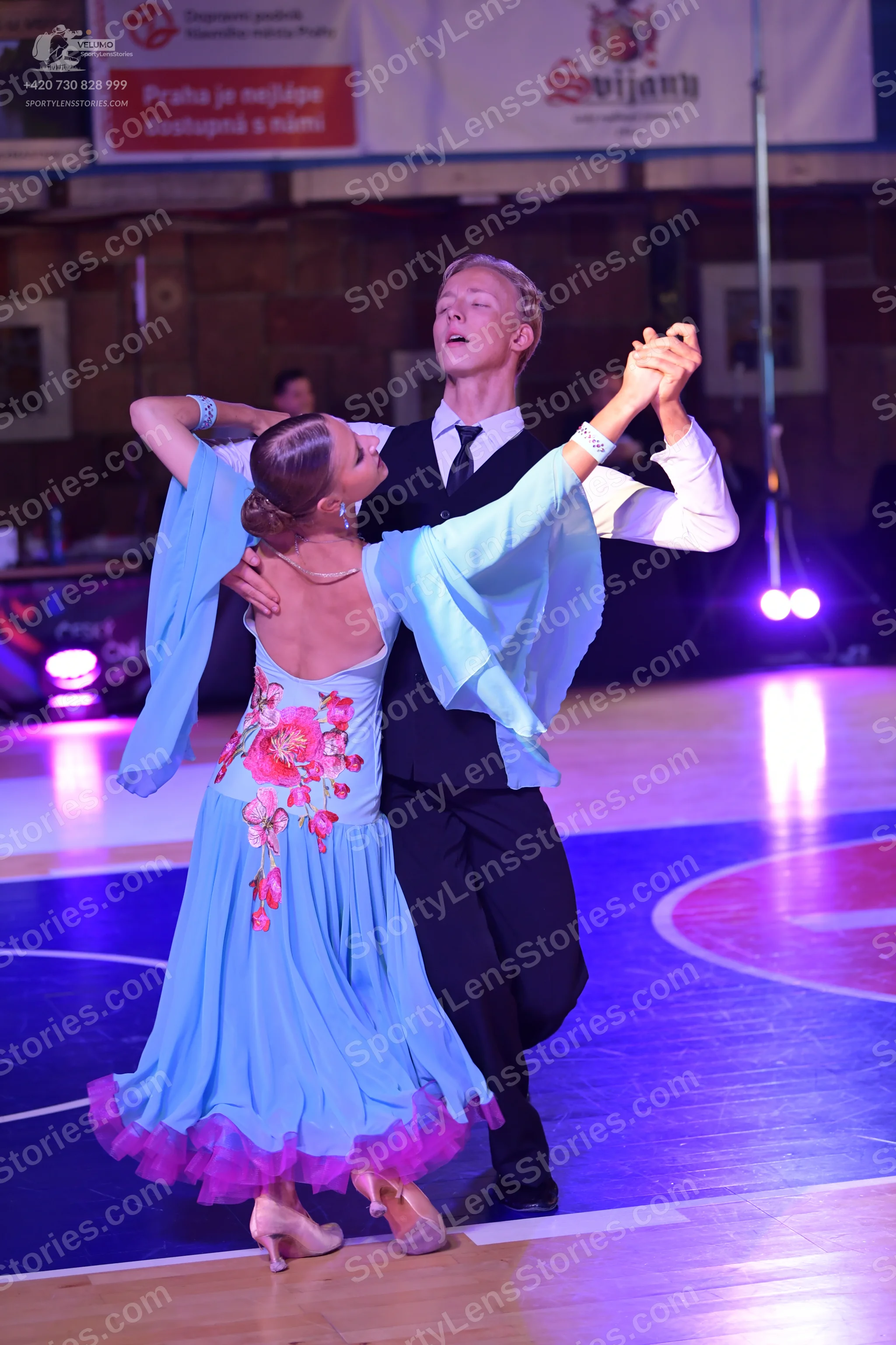 Dancesport competitor: Male dancer: black waistcoat, white long-sleeved shirt, black necktie, and black