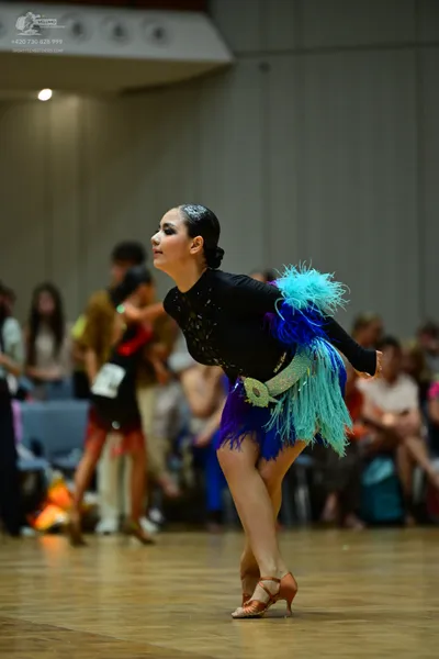 Dancesport competitor: ** Black Latin Dress
*   **Fabric:** Primarily satin with sequin accents
*   **S