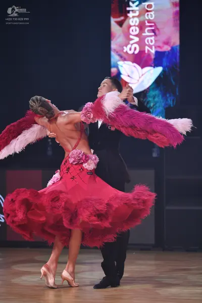 Dancesport competitor: Male dancer: black suit with black trousers and black shoes