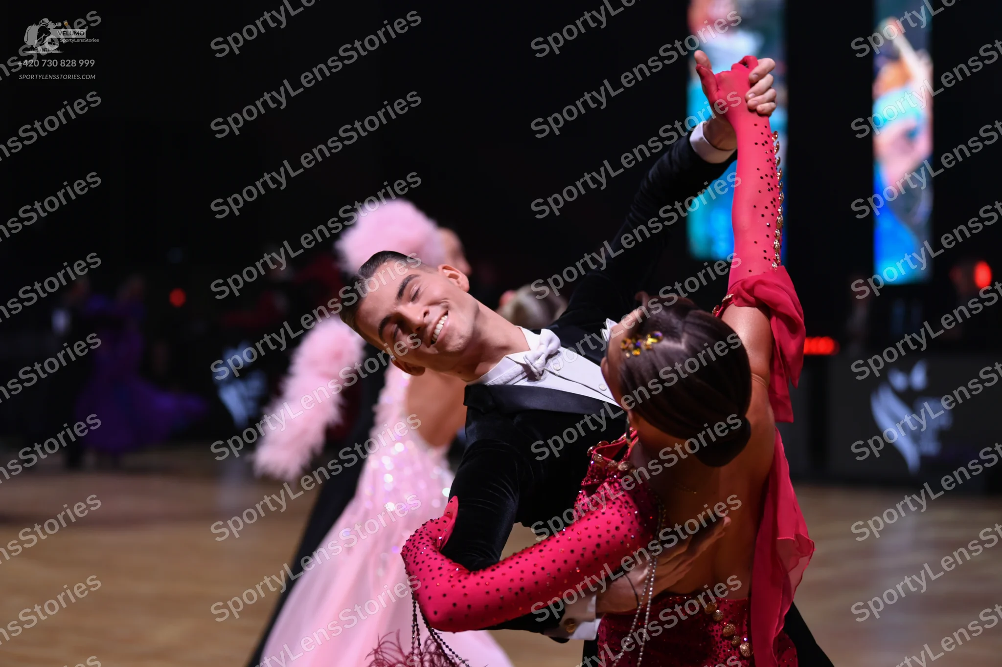 Dancesport competitor: Male dancer: black suit with white shirt and white bow tie