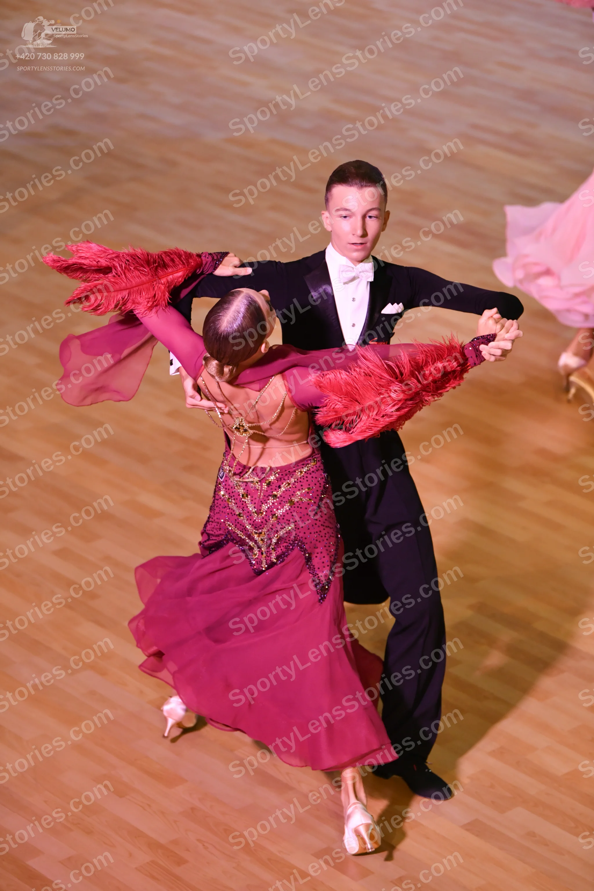 Dancesport competitor: Male:** Black tailsuit with a wide, sequin-covered lapel