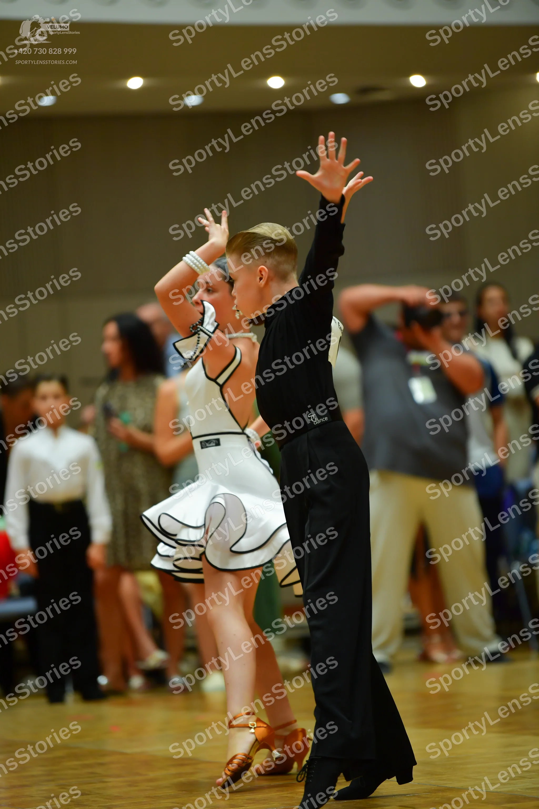Dancesport competitor: Male dancer: black long-sleeved shirt and black trousers