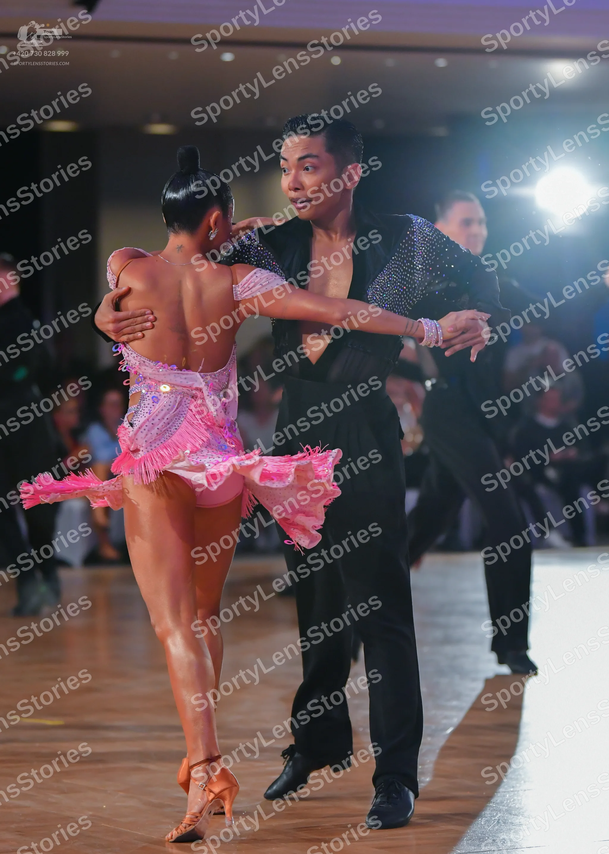 Dancesport competitor: Female dancer: pink latin dress with sequins and fringe