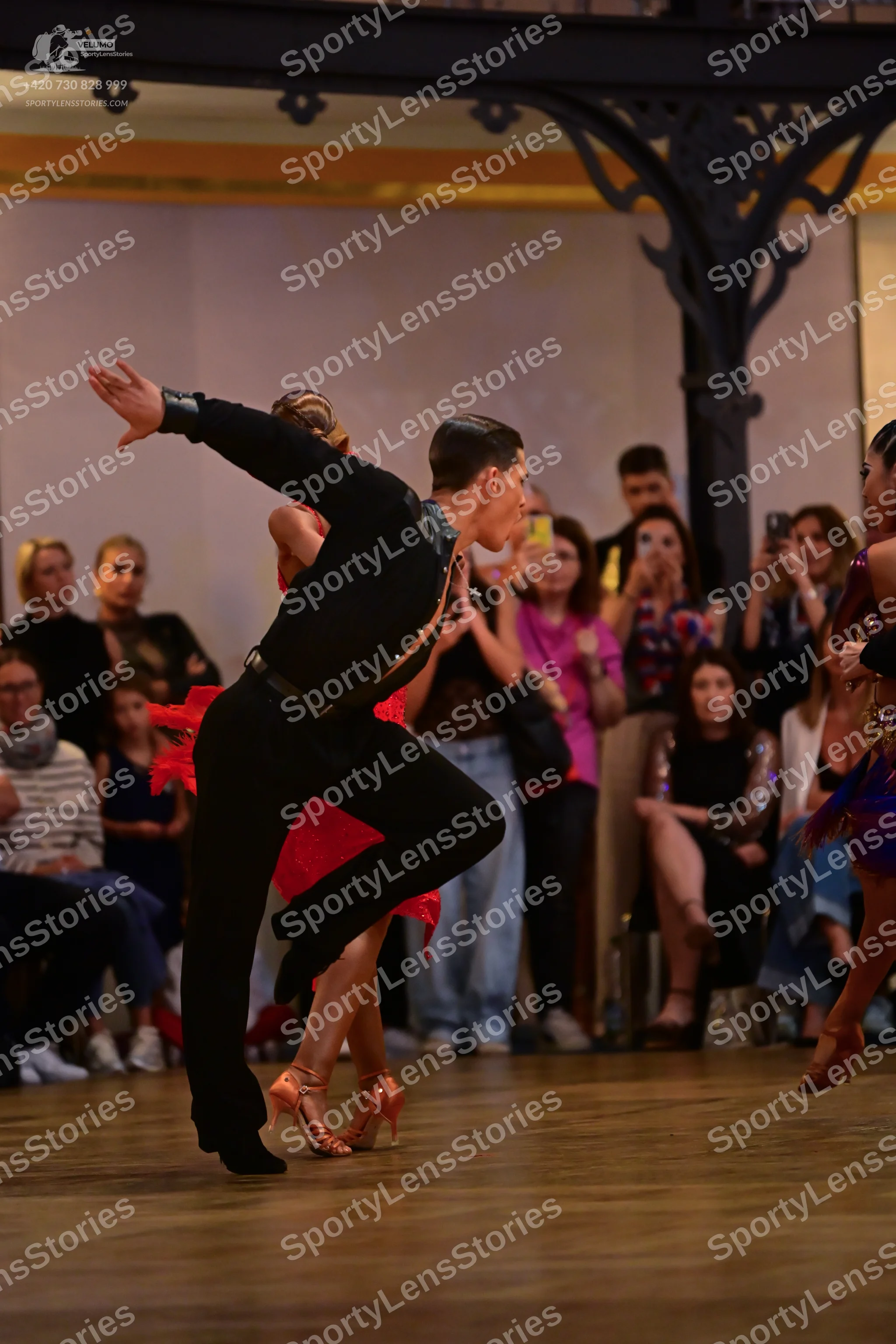 Dancesport competitor: Male dancer: black long-sleeved shirt and black trousers