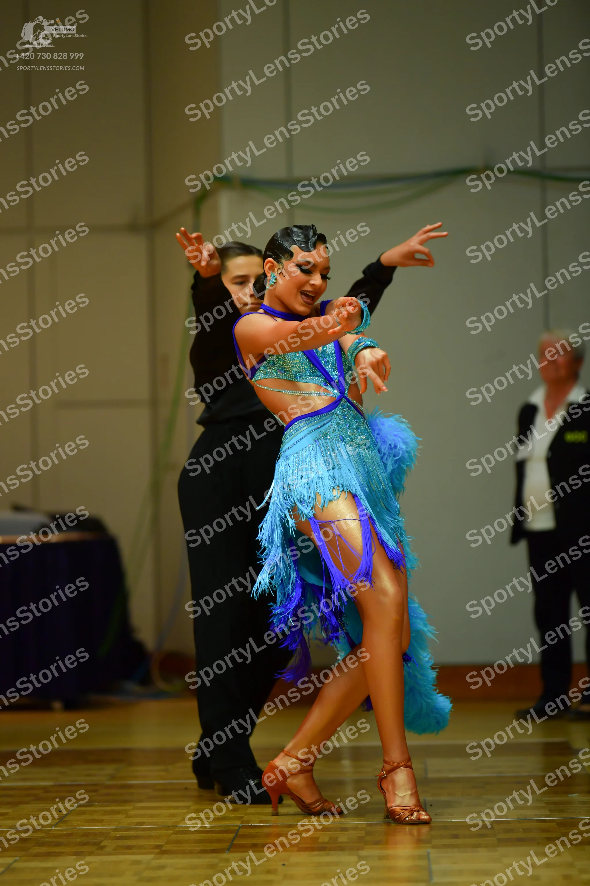 Dancesport competitor: Male dancer: black long-sleeved top and black trousers