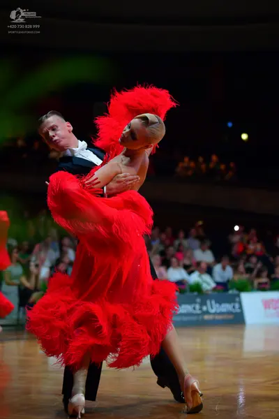 Dancesport competitor: Male dancer: black suit with a white shirt and black bowtie