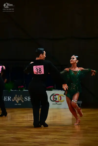 Dancesport competitor #38: Male dancer: black long-sleeved shirt and black trousers