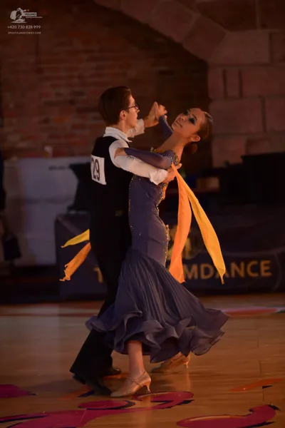 Dancesport competitor #29: Male dancer: white long-sleeved shirt, black vest, and black trousers