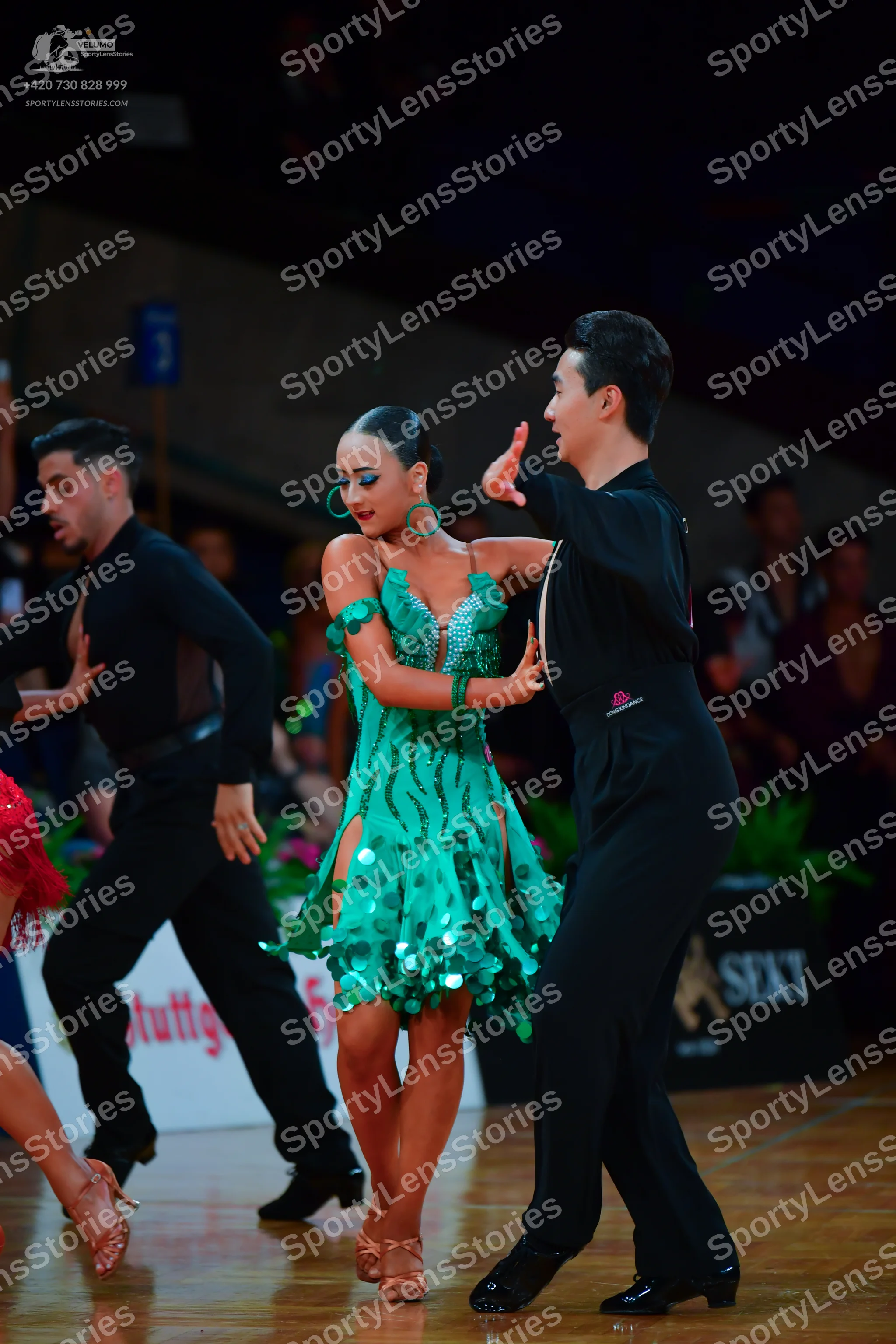 Dancesport competitor: Male dancer (left): black long-sleeved shirt and trousers