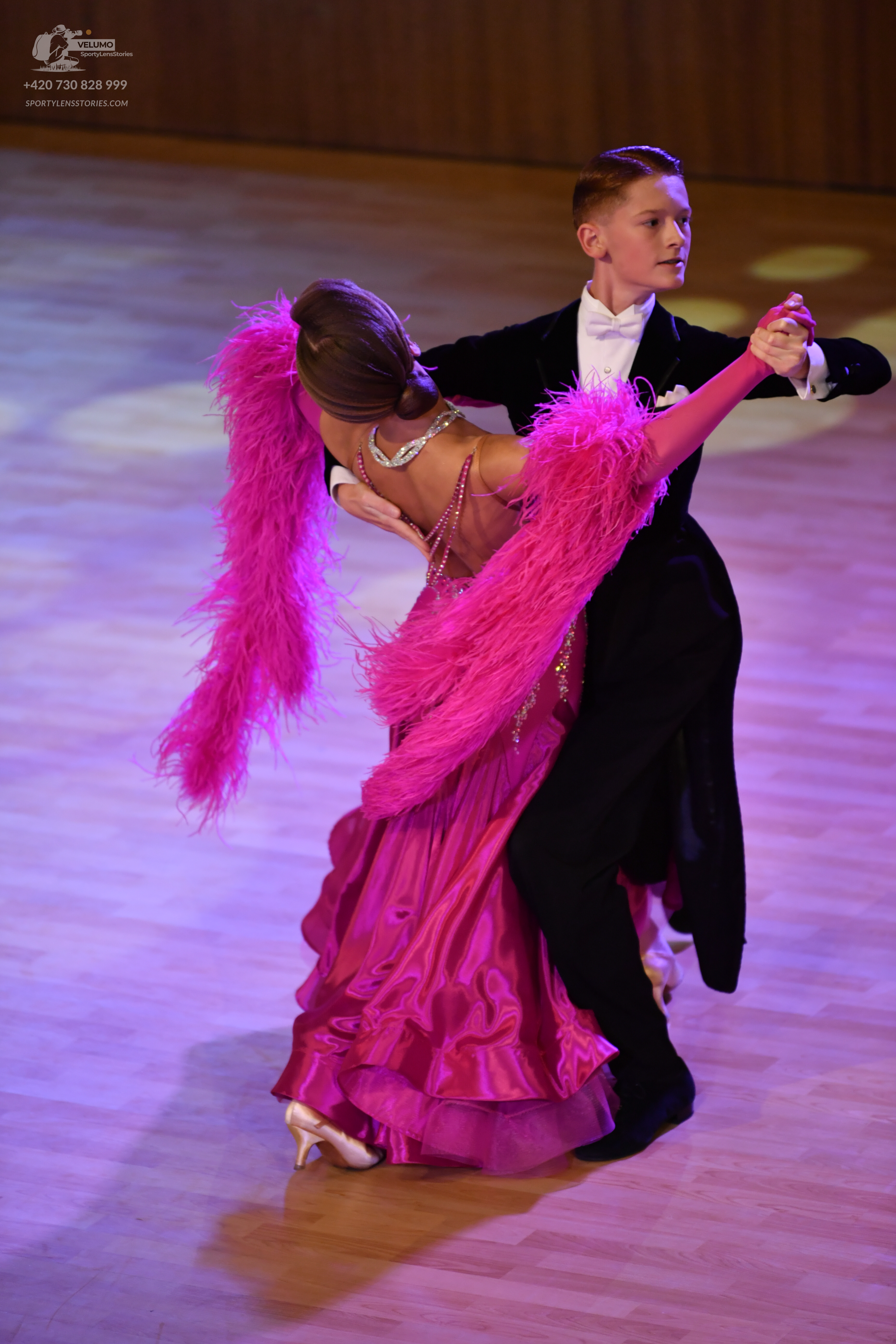 Dancesport competitor: ** Black tail suit with a white sequin lapel