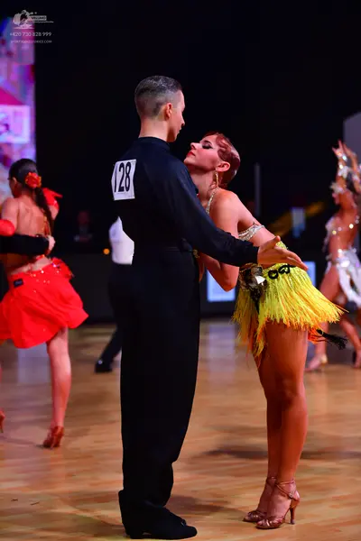 Dancesport competitor: Male dancer: black long-sleeved shirt and trousers