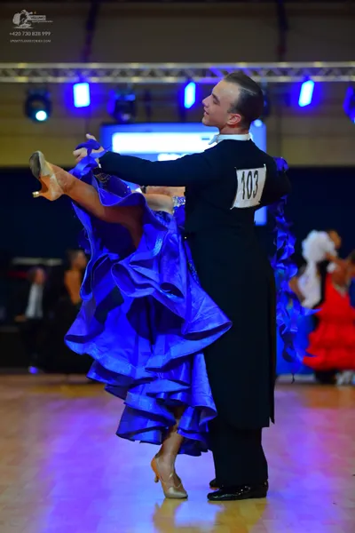 Dancesport competitor #103: Male dancer: black long-sleeved shirt and black trousers